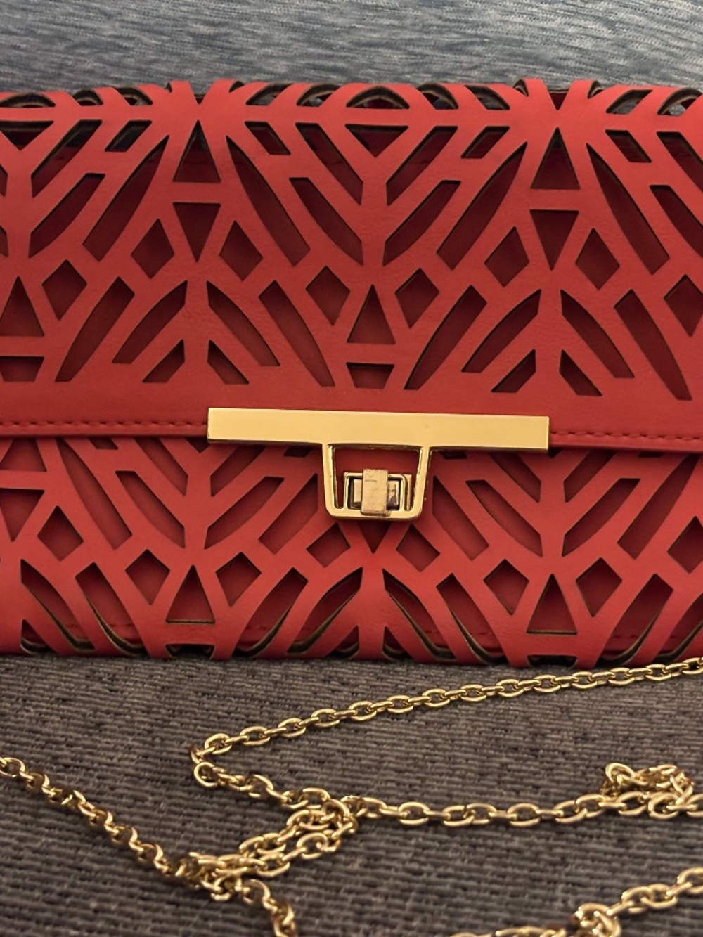 Tosca Coral Colored Laser Cut Clutch with Gold Tone Chain Shoulder Strap